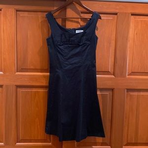 LBD. Empire waist, sleeveless with detail on the chest. Falls above the knee